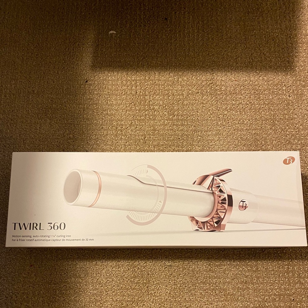 Brand new, open but never used. T3 360 Curling Iron
